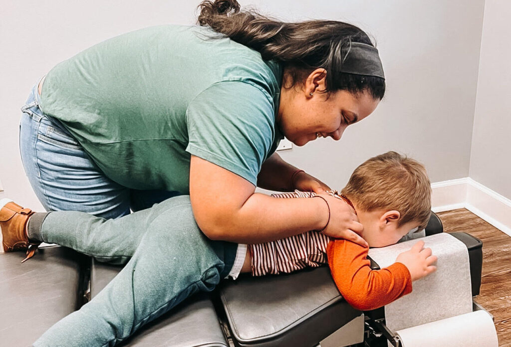 Pediatric patient face down on table