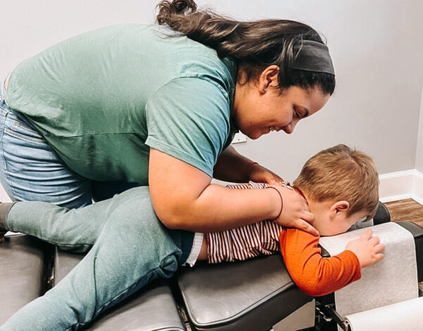 Pediatric patient face down on table